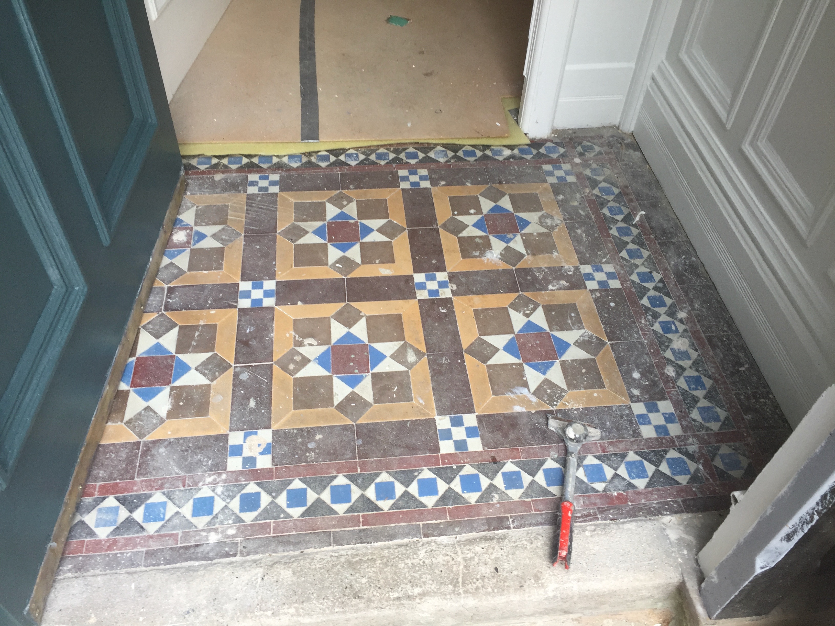 Victorian geometric floor before restoration